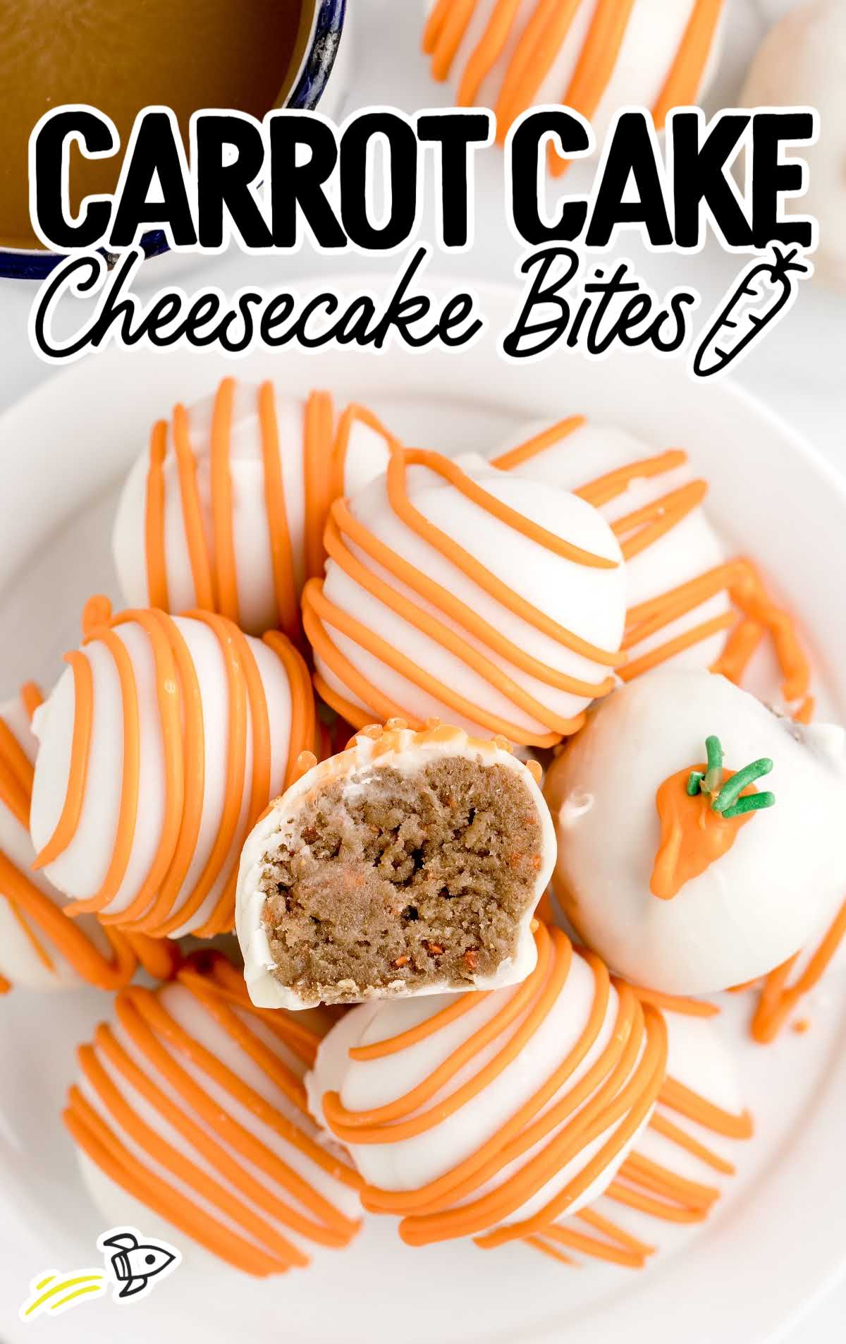 overhead shot of Carrot Cake Cheesecake Bites with one having a bite taken out off