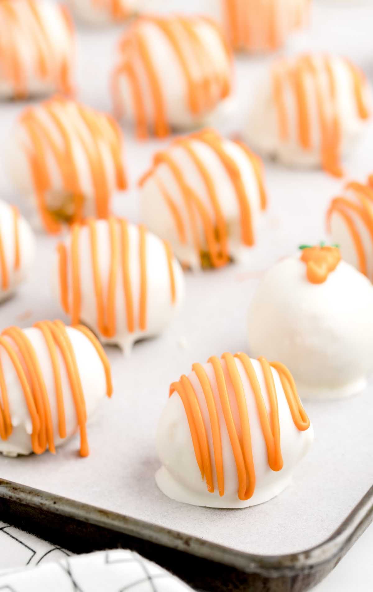 a close up shot of Carrot Cake Cheesecake Bites on a baking pan