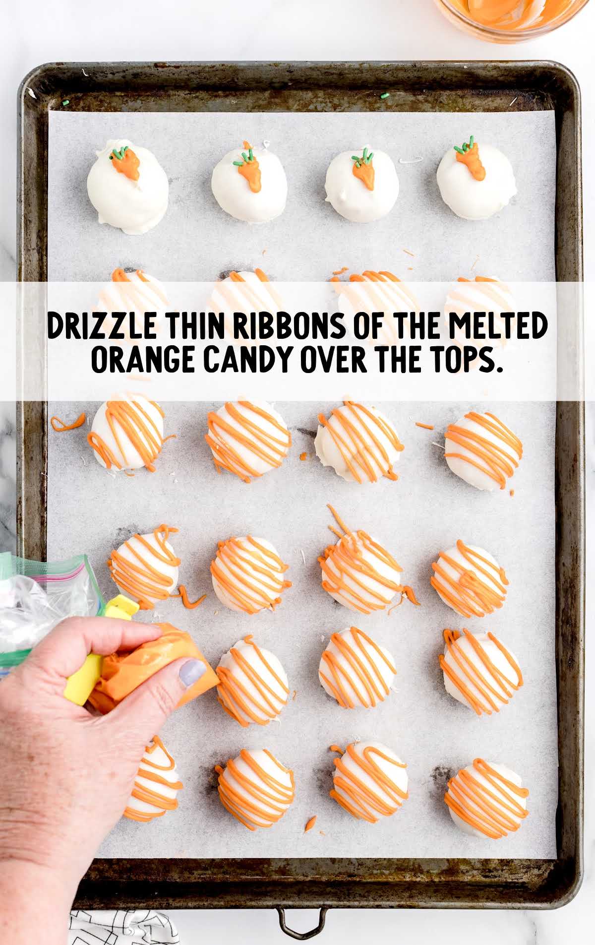 melted orange candy drizzled over the bites