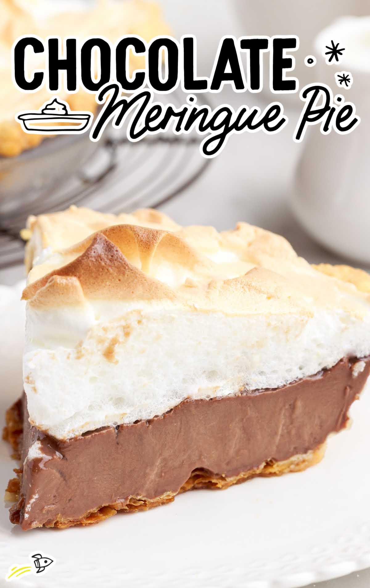 a close up shot of a slice of Chocolate Meringue Pie on a white plate