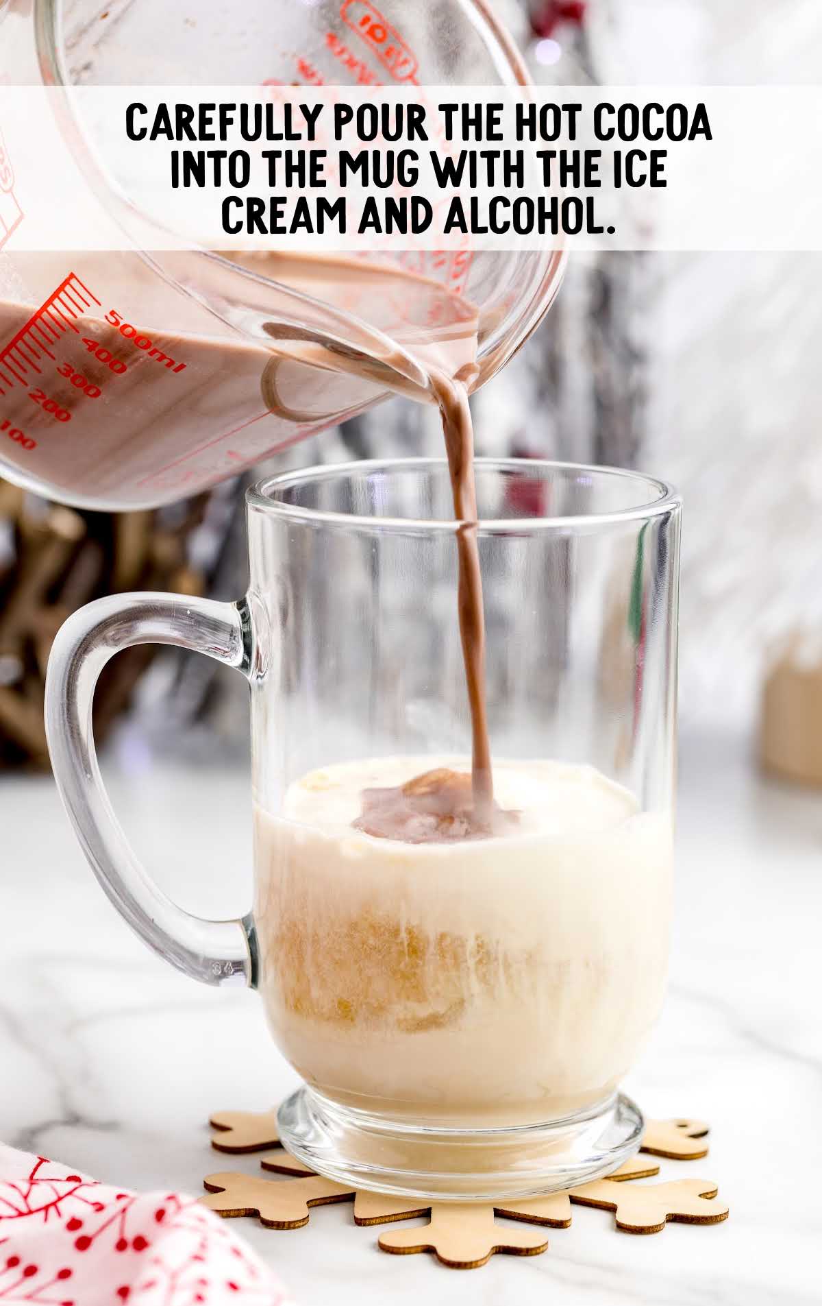 hot cocoa poured into a mug with the ice cream and alcohol