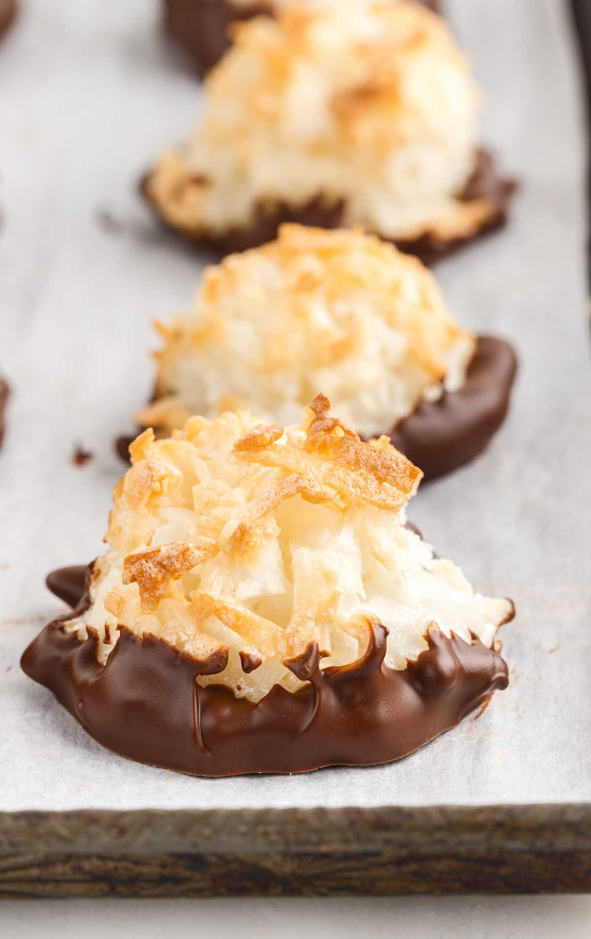 a close up shot of a coconut macaroons in a cookie sheet