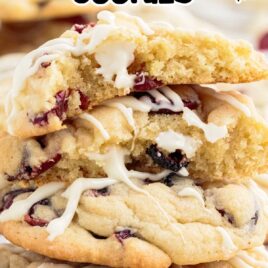close up shot of Cranberry White Chocolate Cookies stacked on top of each other and one split in half