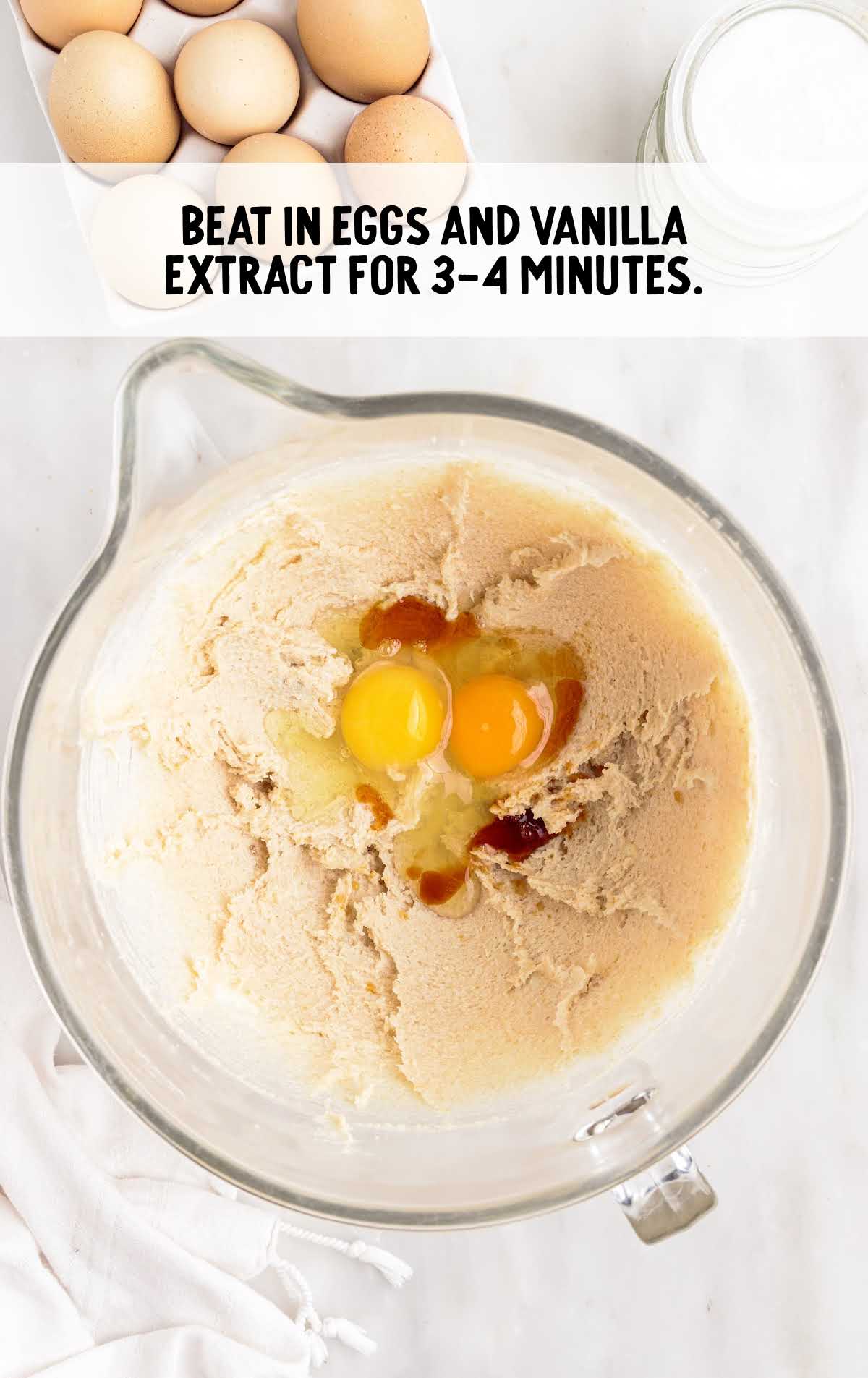 eggs and vanilla extract mixed in a cup