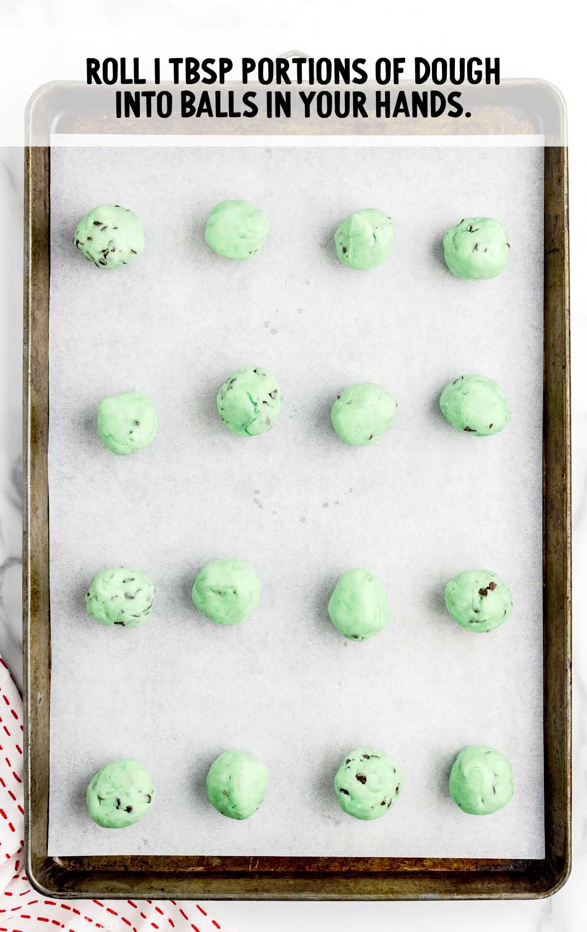 dough rolled into balls by using hands and place on baking sheet