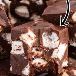 close up shot of pieces of Marshmallow Fudge stacked on top of each other with one having a bite taken out of it