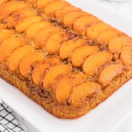 close up shot of Peach Upside-Down Cake in a baking dish