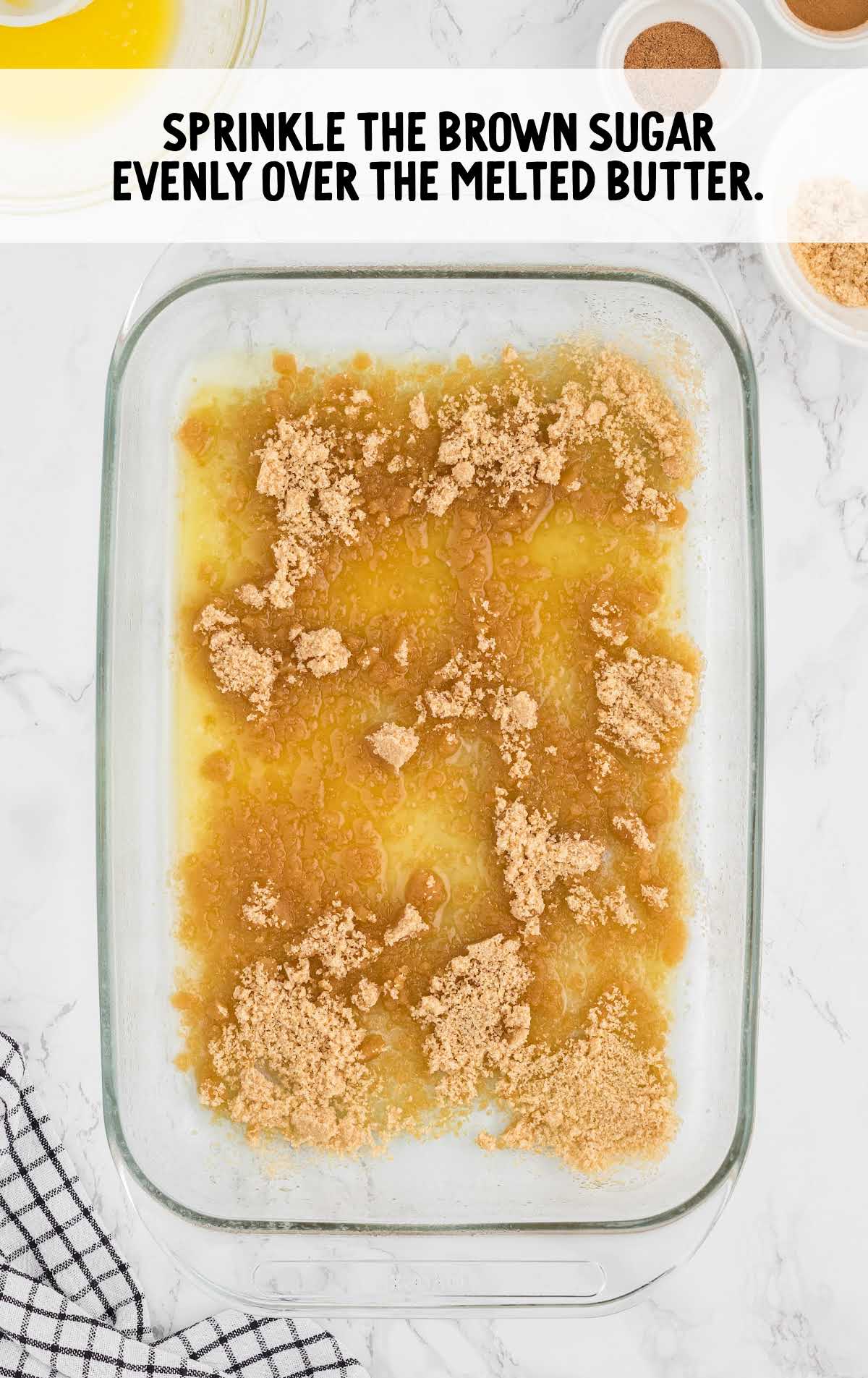 brown sugar sprinkled over the melted butter in a baking dish