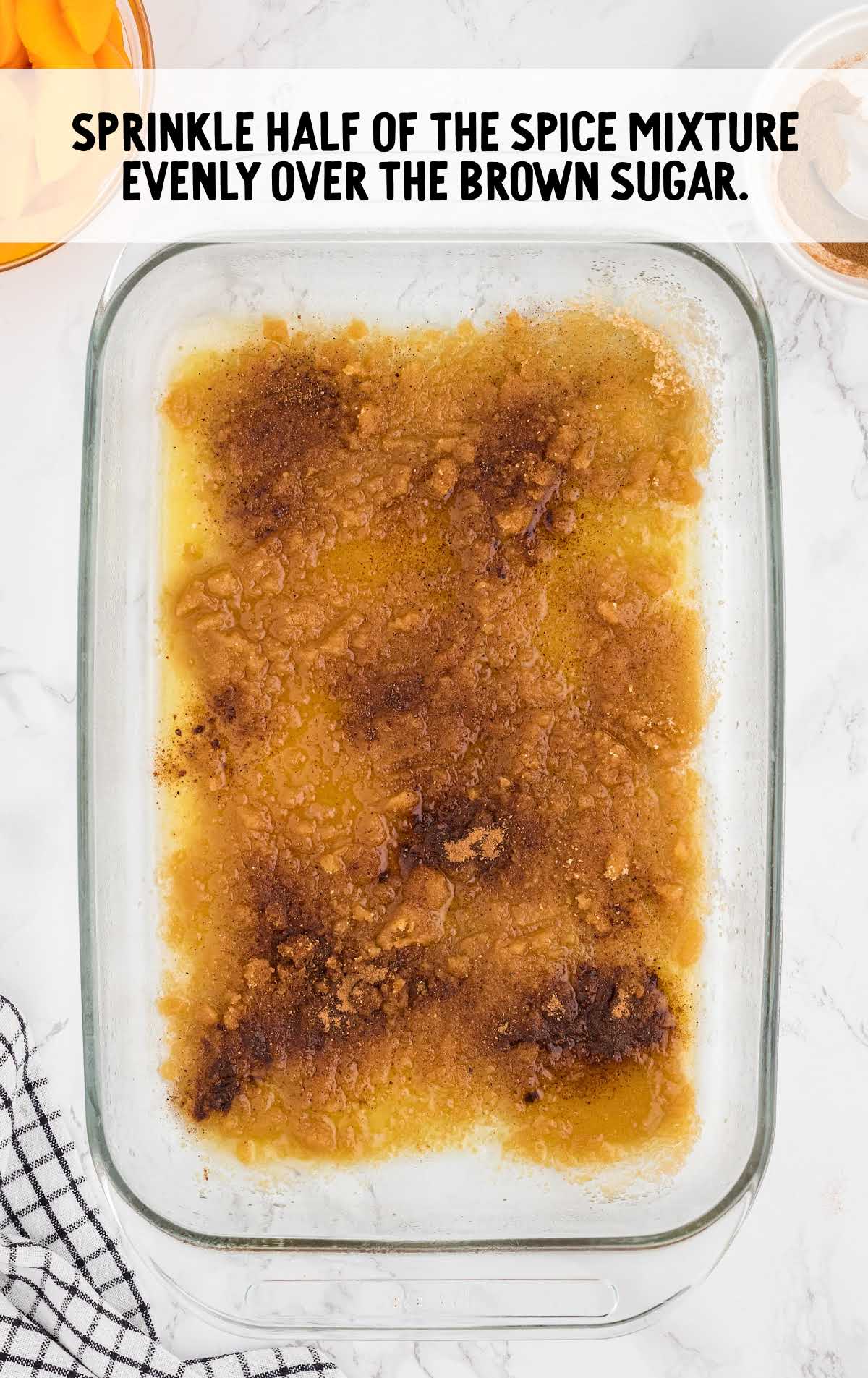 spice mixture poured over the brown sugar in a baking dish