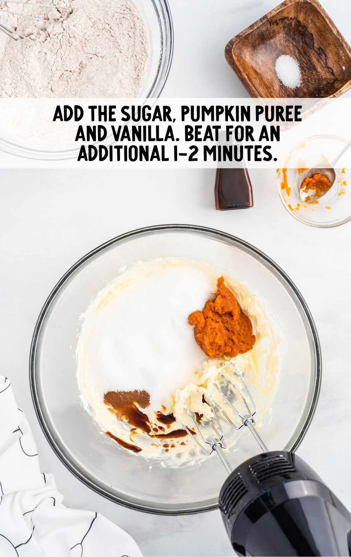 sugar, pumpkin puree, and vanilla blended in a bowl