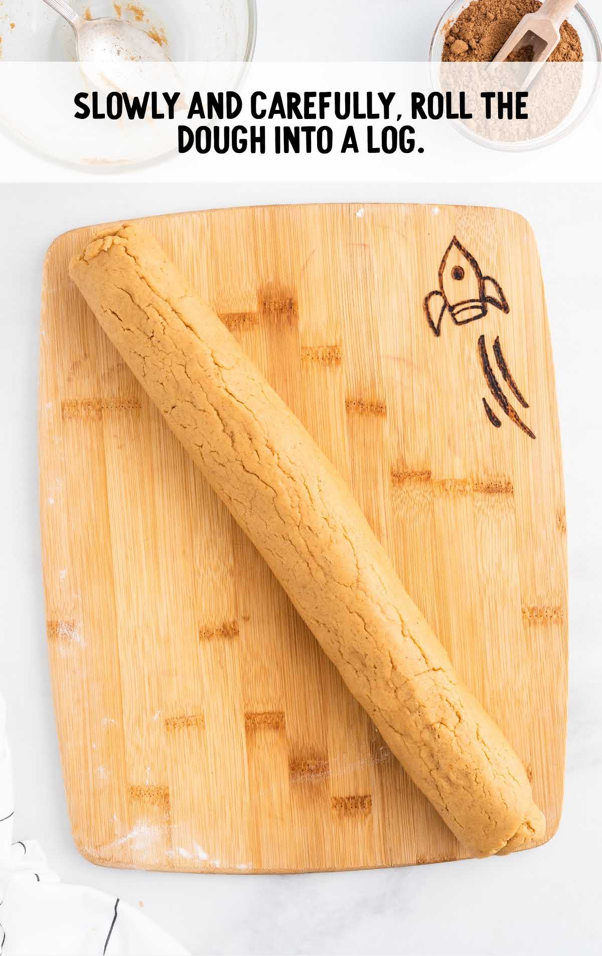 dough rolled on a wooden cutting board