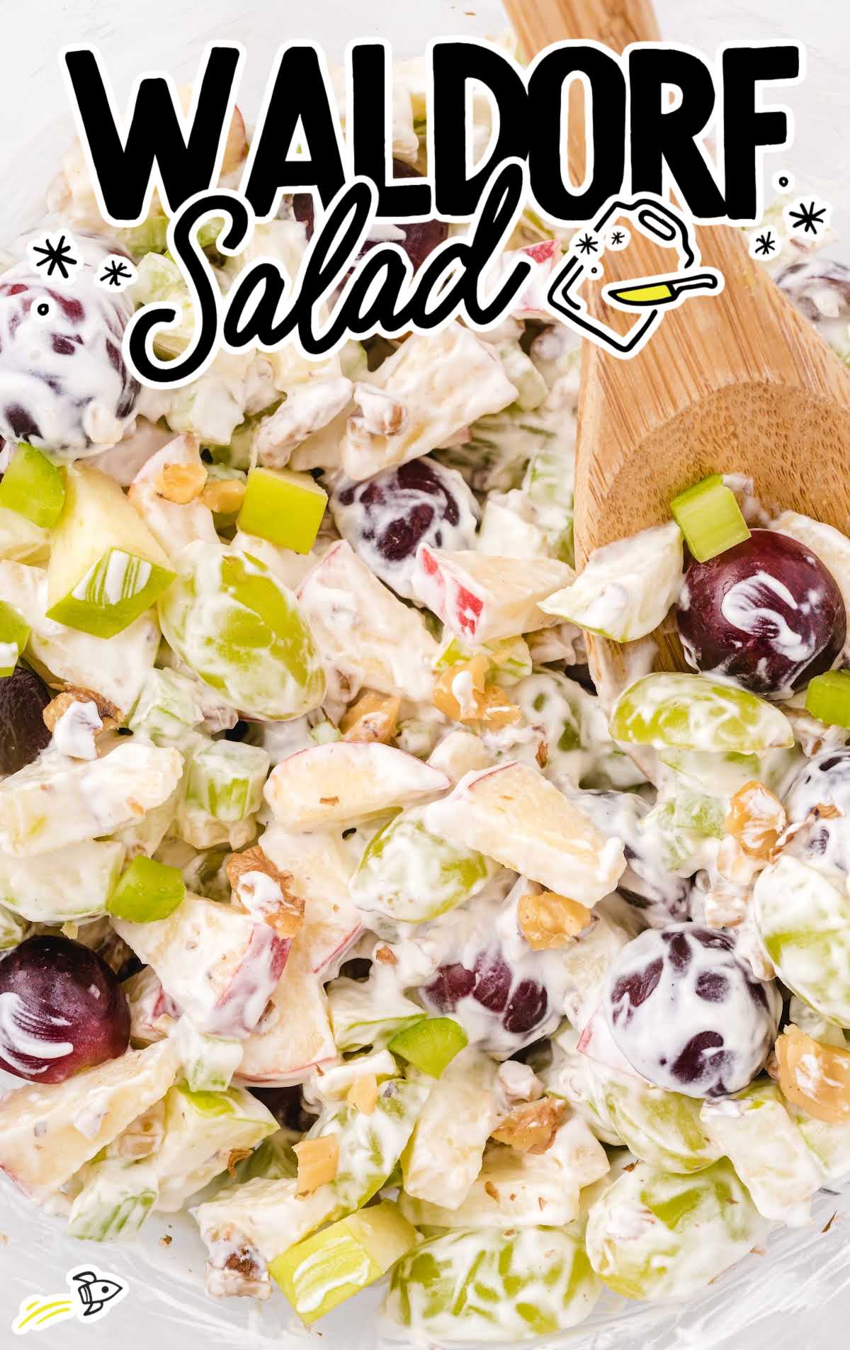 overhead shot of Waldorf Salad with a spoon grabbing a piece