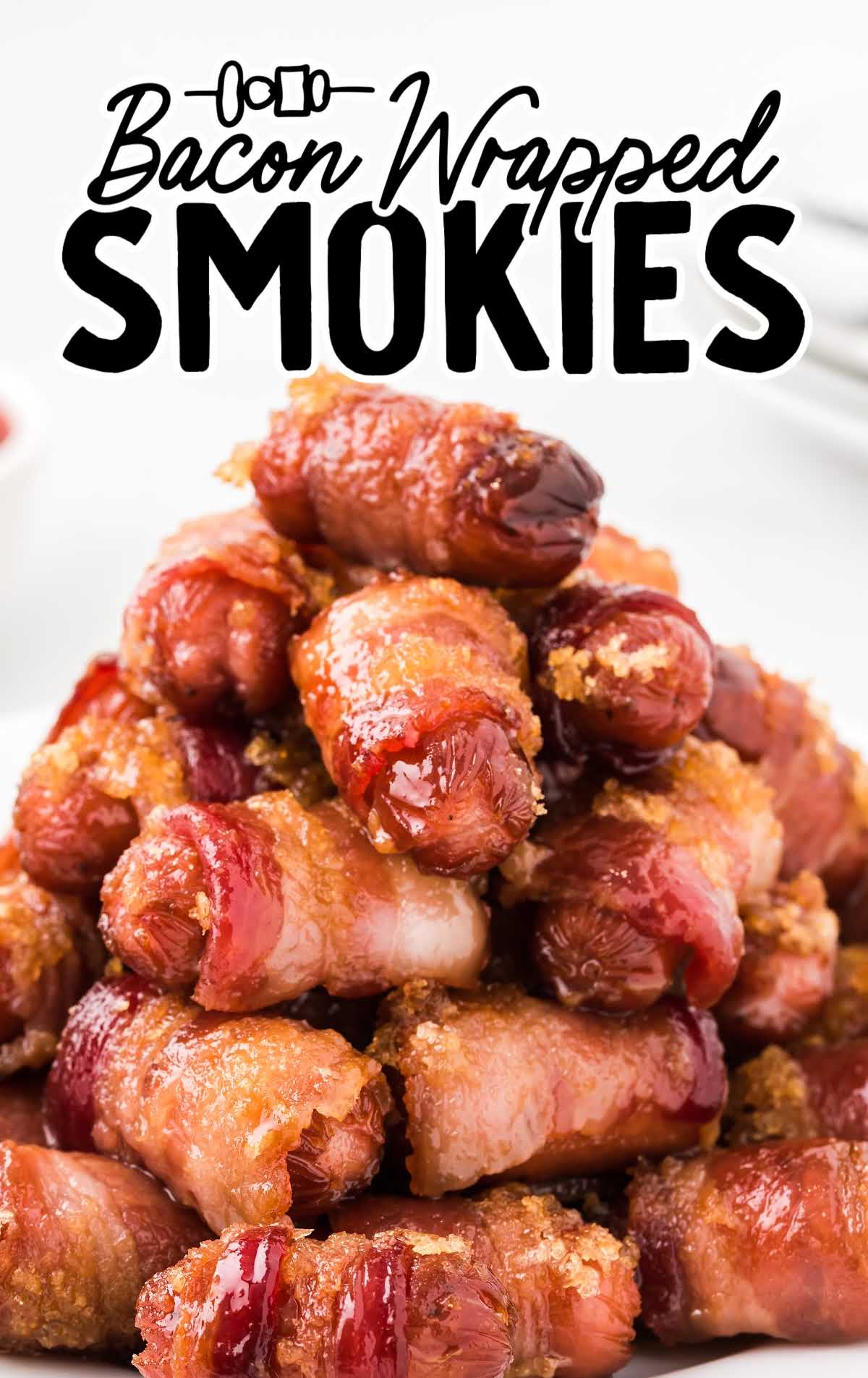 a close up shot of Bacon Wrapped Smokies staked on top of each other on a plate