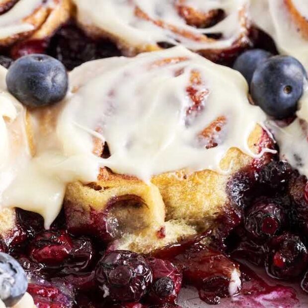 a close up shot of blueberry cinnamon rolls