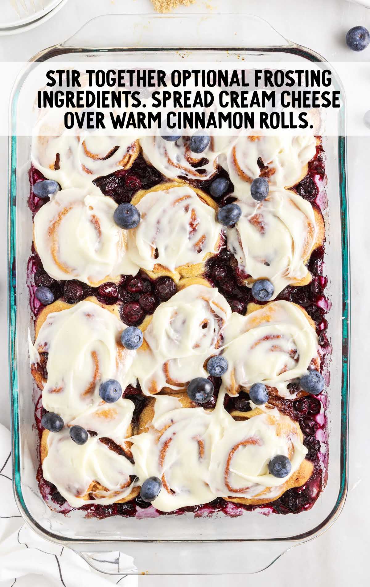 optional frosting ingredients stirred and spread cream cheese over cinnamon rolls in a baking dish