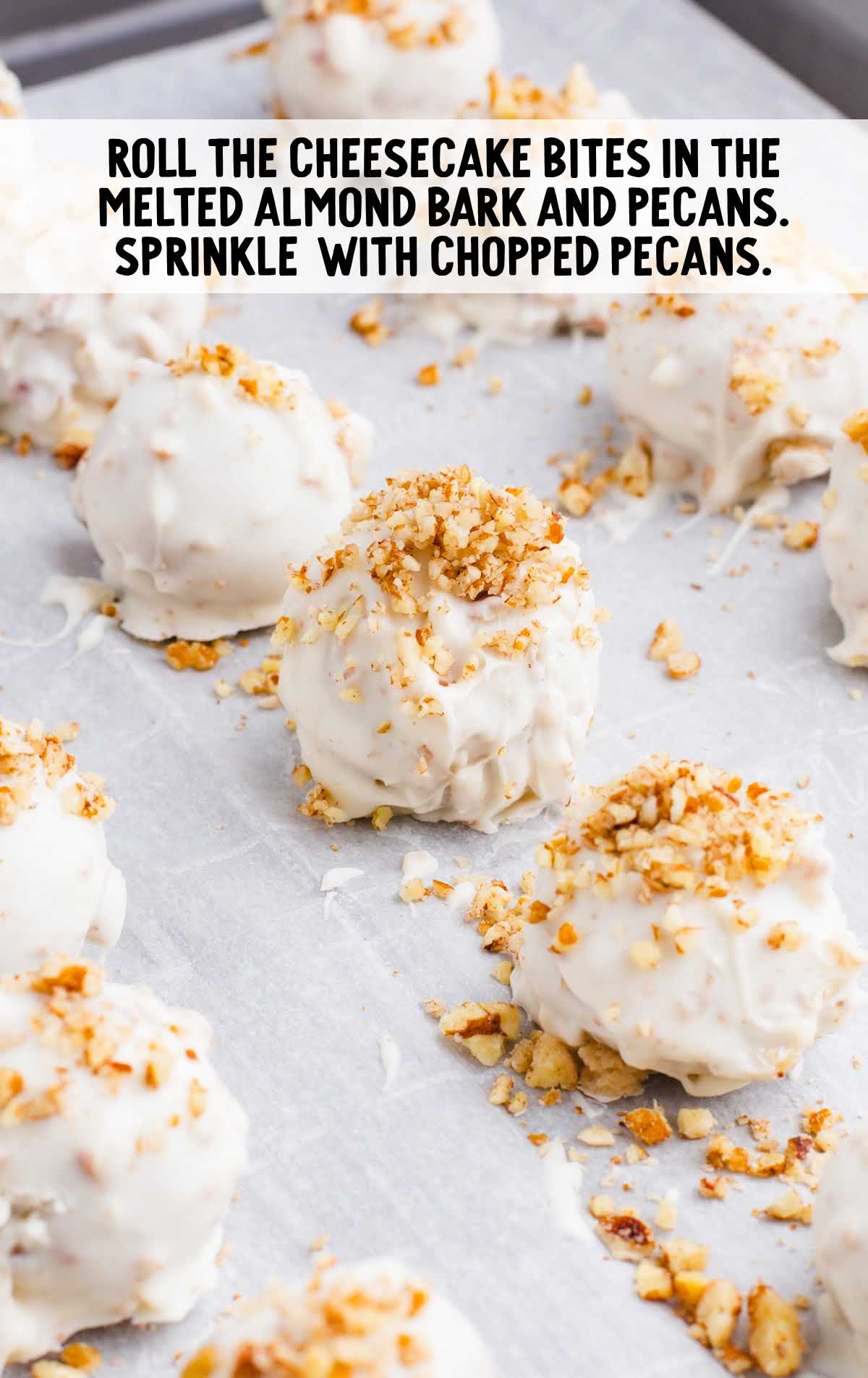 cheesecake bites rolled in the melted almond bark and pecan
