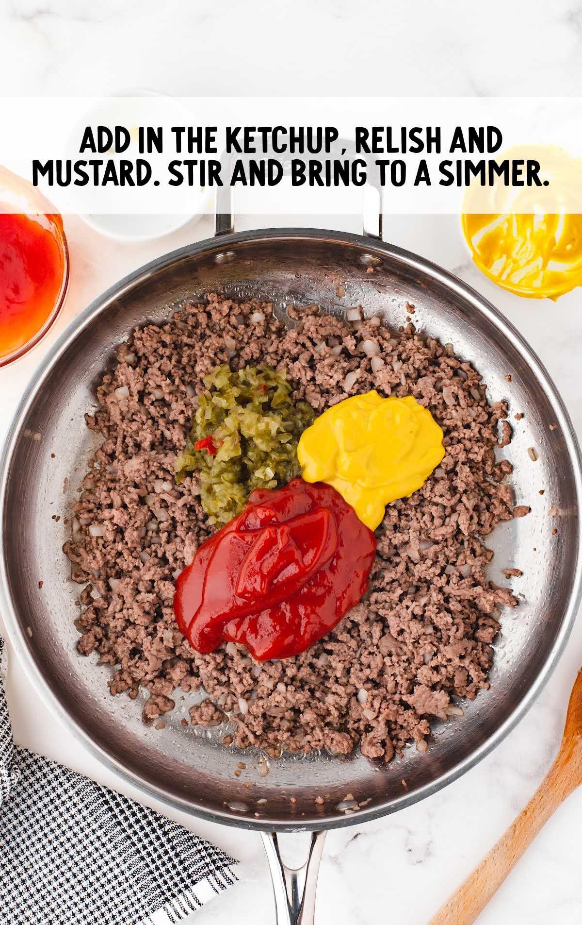 ketchup, relish, and mustard added to to a skillet and stirred together