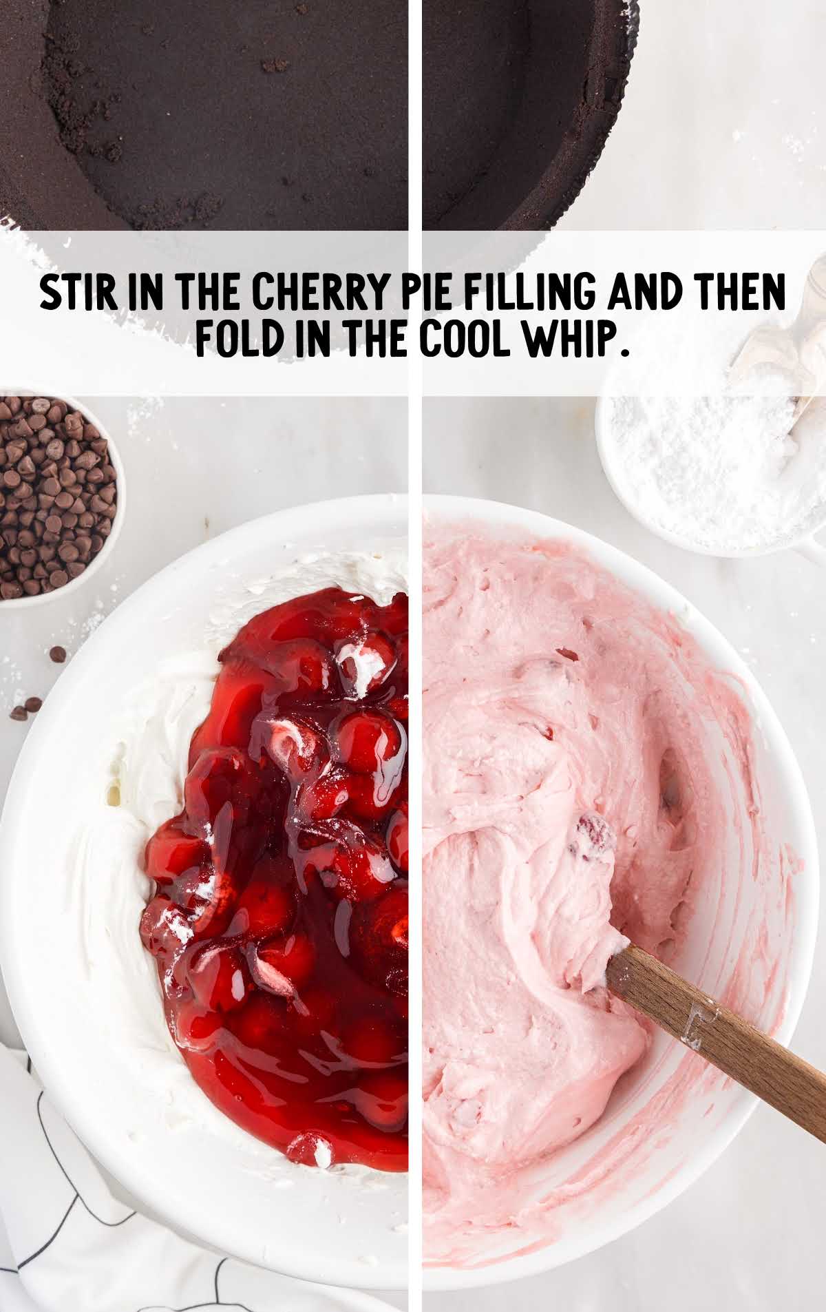 cherry pie filling folded in the cool whip in a bowl