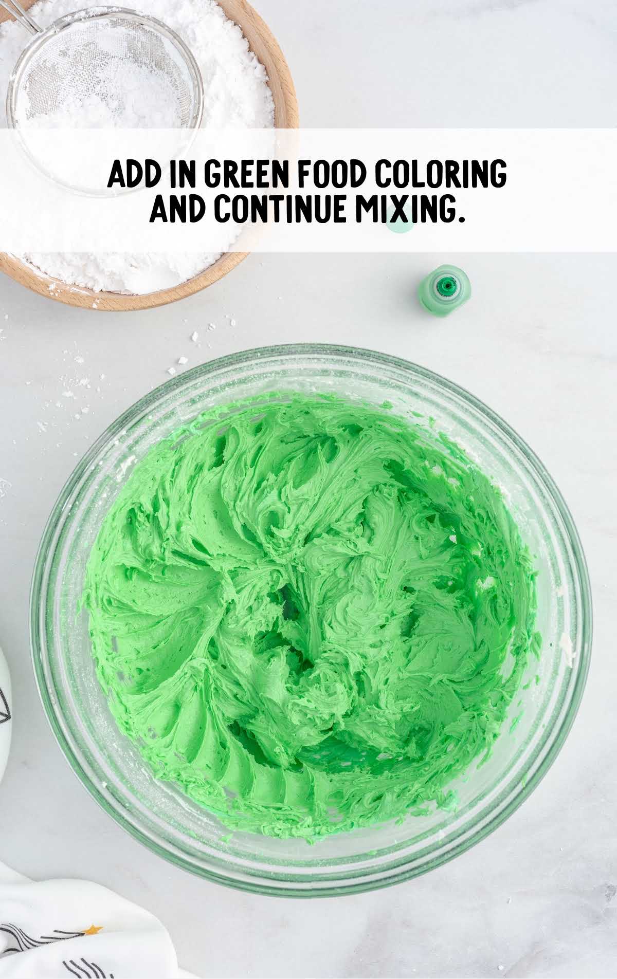 green coloring added to the vanilla mixture in a bowl