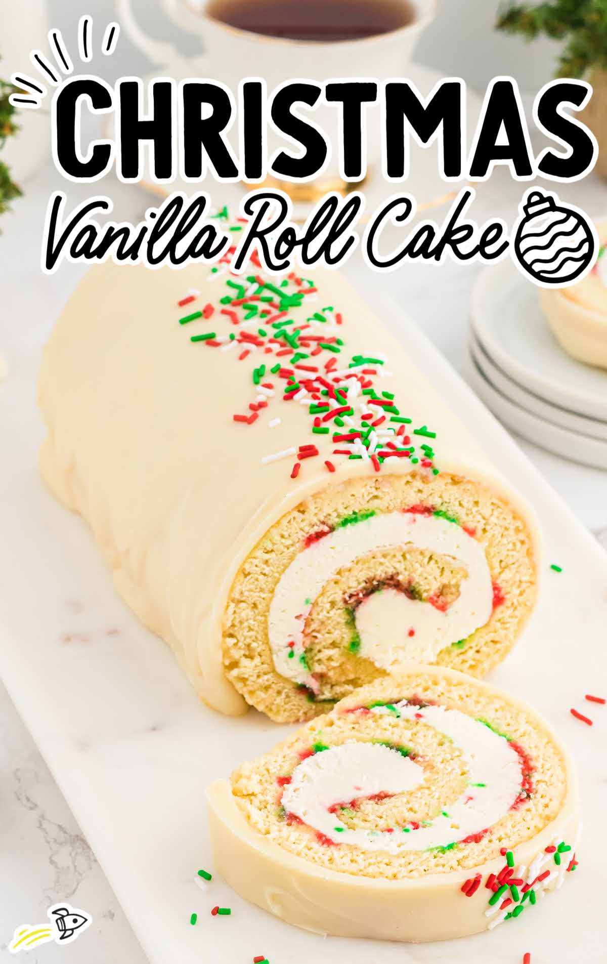 a close up shot of a slice of Christmas Vanilla Roll Cake with a piece cut off