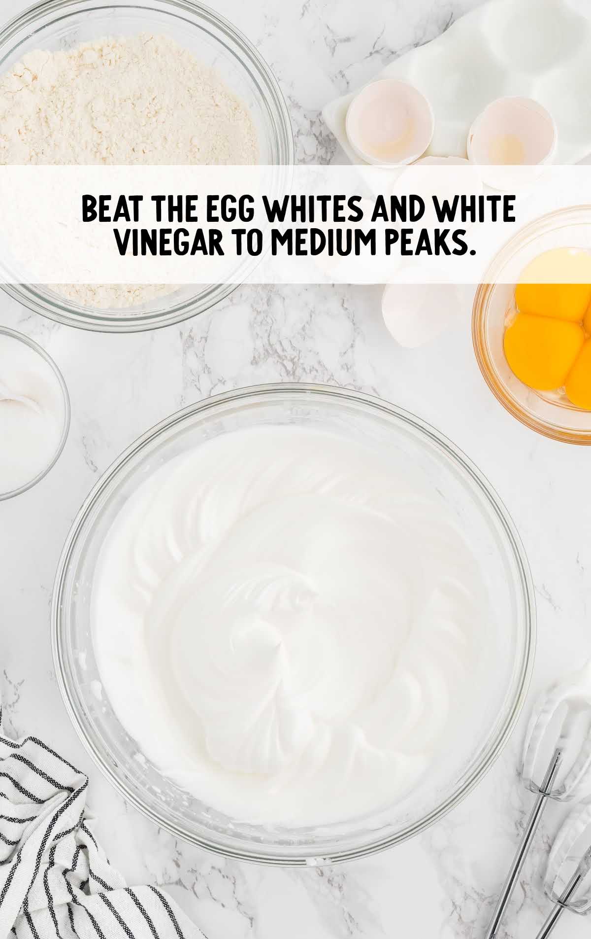 egg white and white vinegar folded in a bowl