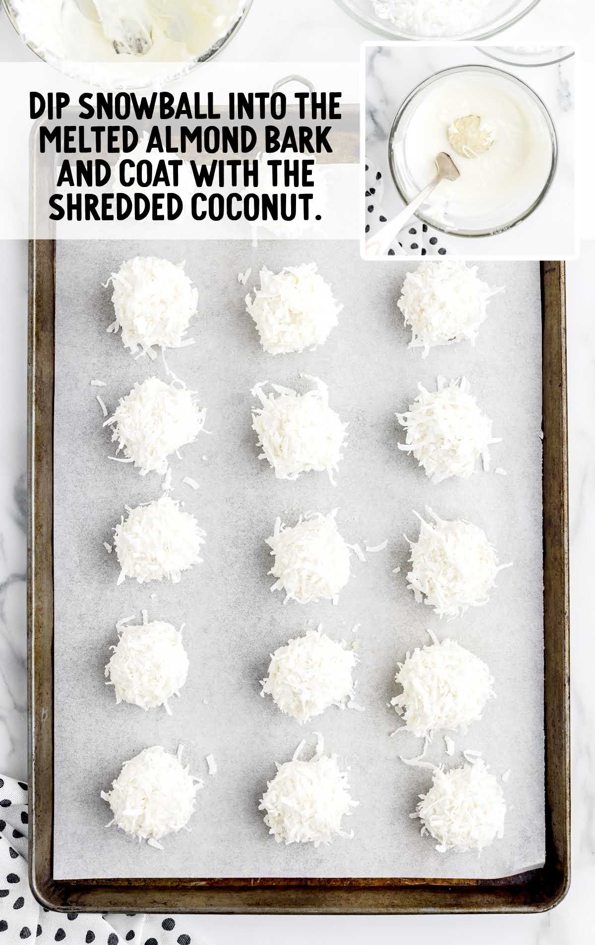 snowballs dipped into the melted almond bark and coated with the shredded coconut