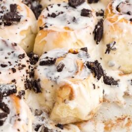a close up shot of Cookies and Cream Cinnamon Rolls with a piece taken out