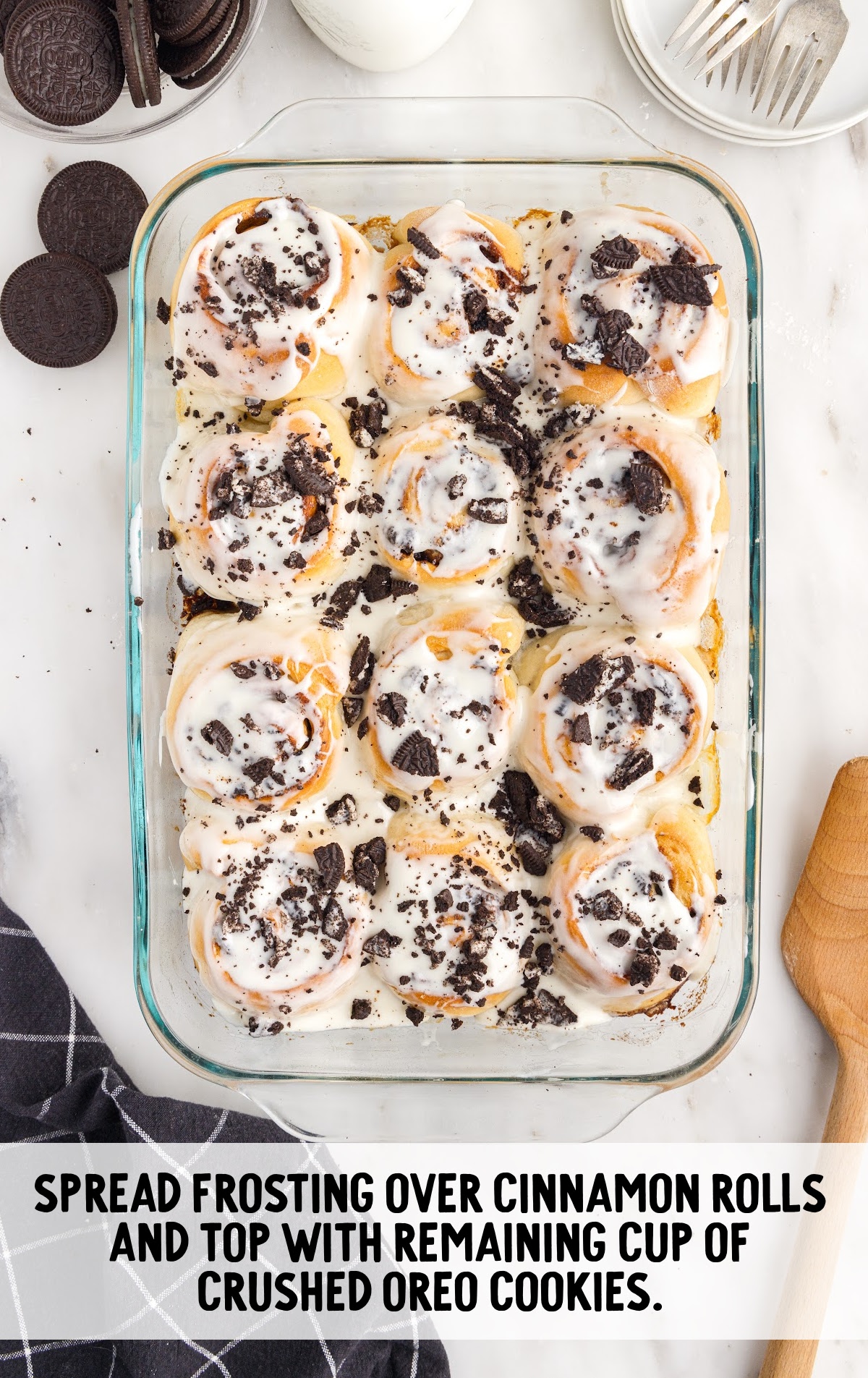 frosting spread over the cinnamon rolls and topped with oreo cookies