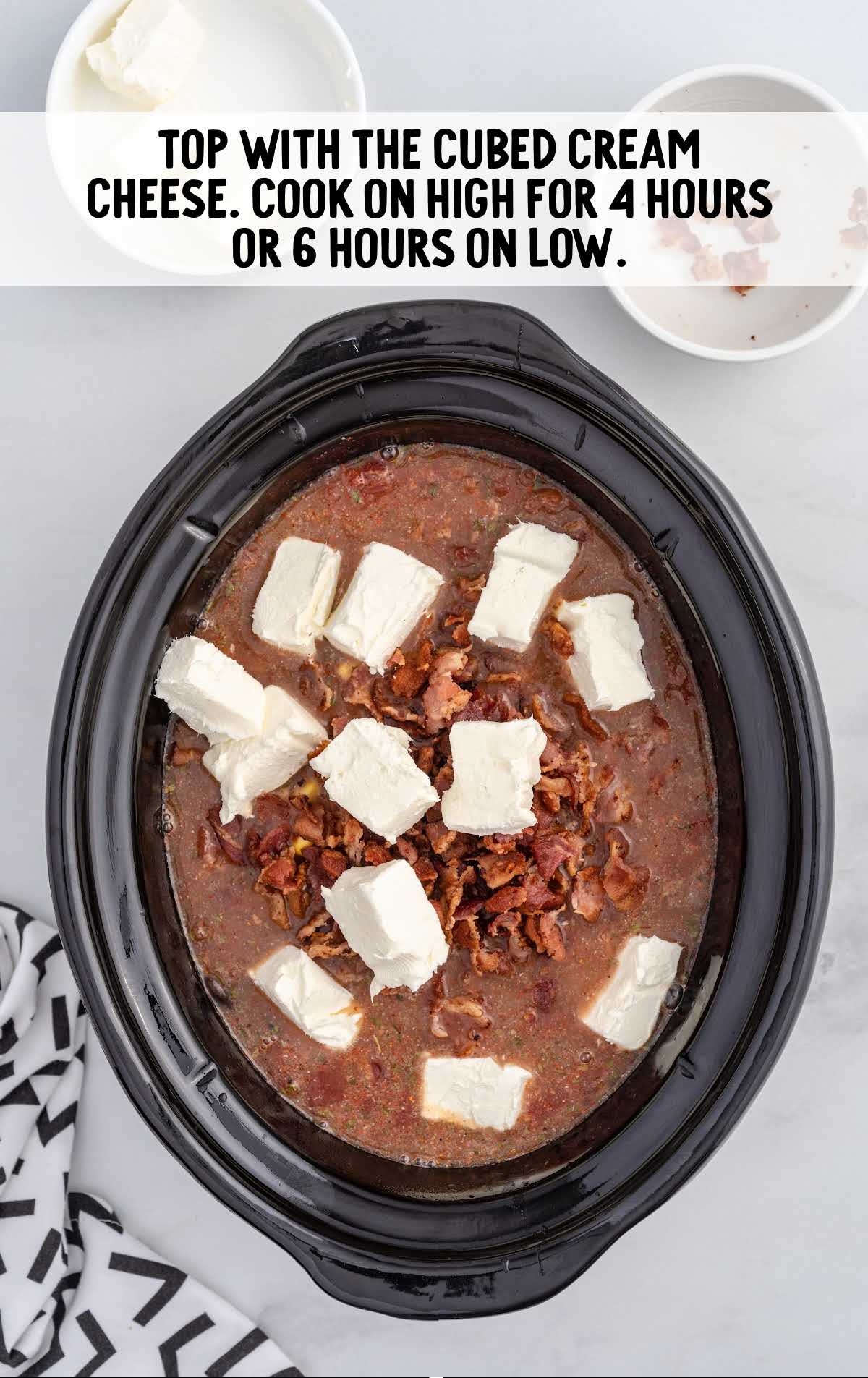 cream cheese added to the bacon mixture in a crock pot