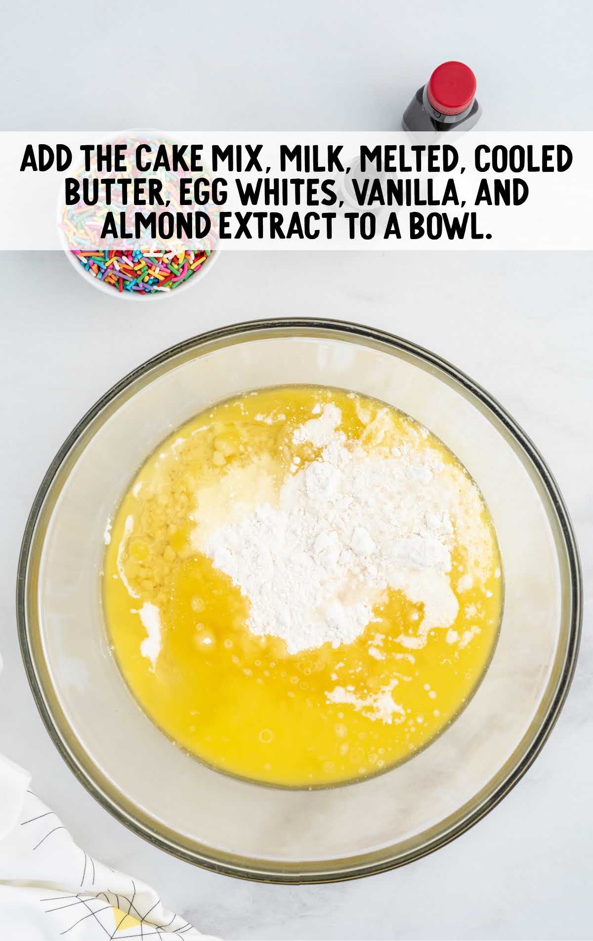 cake mix, milk, cooled butter, egg white, vanilla, and almond extract combined in a bowl