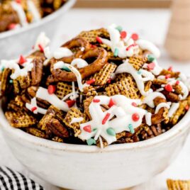 a close up shot of Gingerbread Chex Mix in a bowl