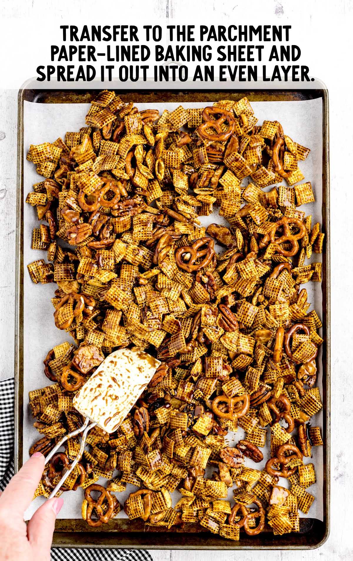 chex mix transferred into a baking sheet