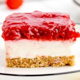 a slice of No Bake Raspberry Cheesecake on a plate