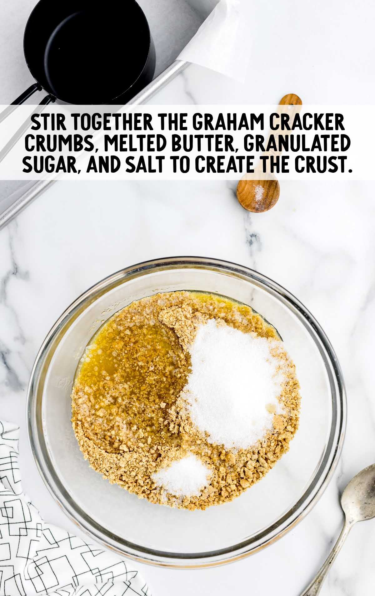 graham cracker crumbs, melted butter, sugar, and salt stirred in a bowl