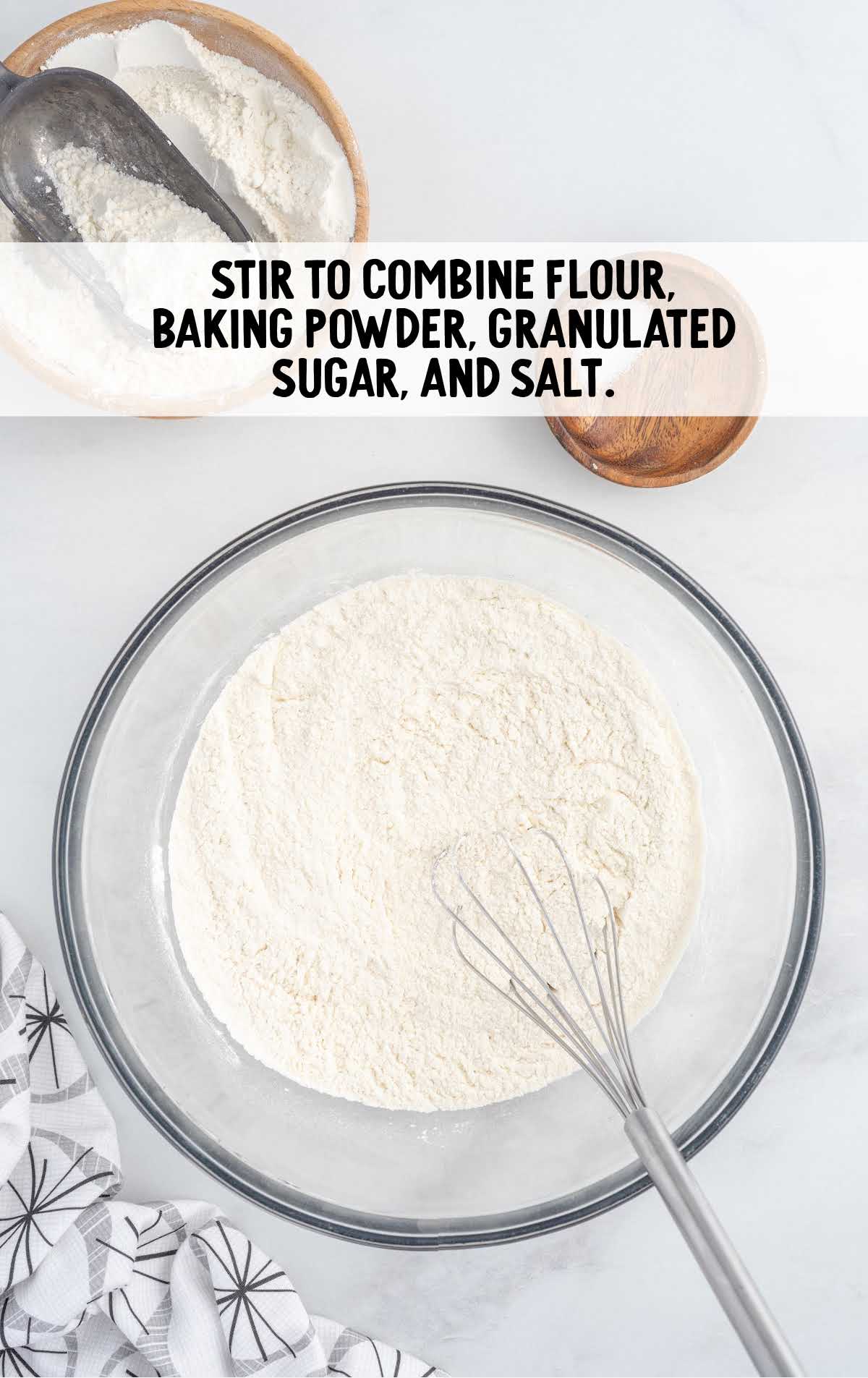 flour, baking powder, granulated sugar, and salt whisked in a bowl