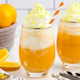 a close up shot of Orange Creamsicle Cocktails in a glass