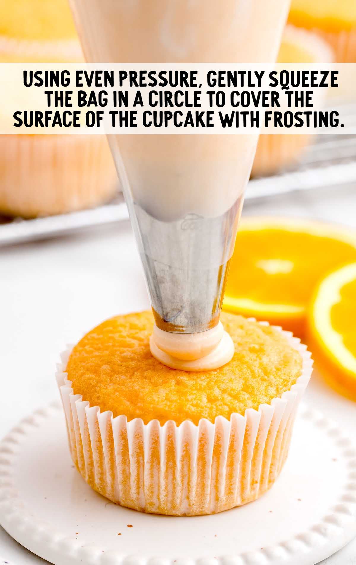 frosting poured on top of the cupcake using ziplock bag