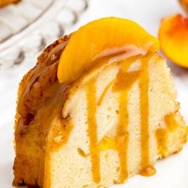 a close up shot of a slice Peach Cobbler Pound Cake