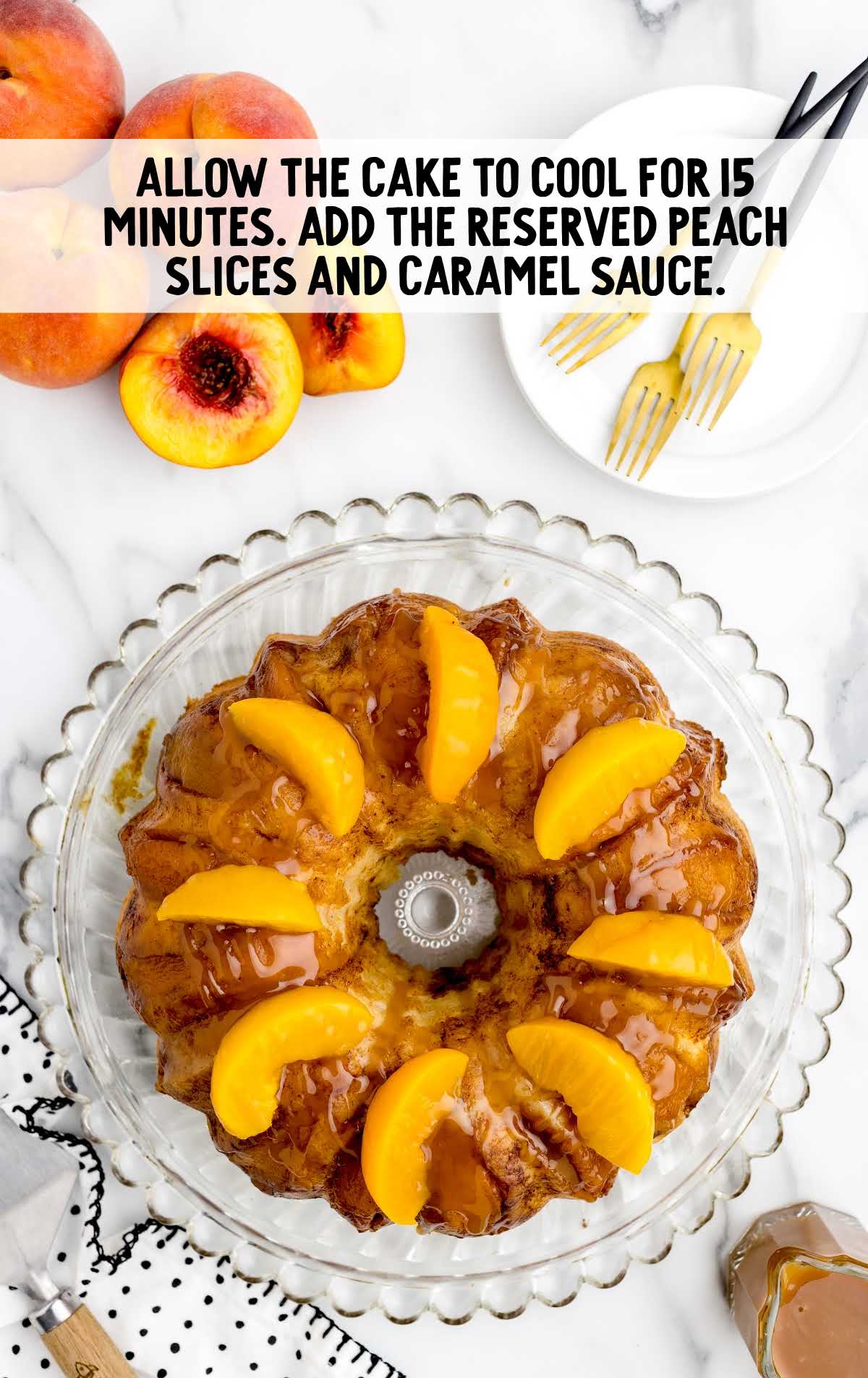 Peach Cobbler Pound Cake cooling on a cake a serving plate