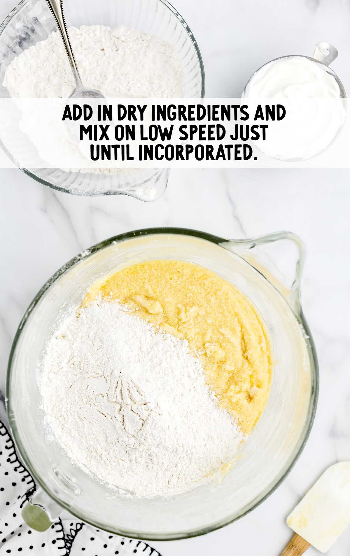 dry ingredients added to the vanilla mixture in a cup
