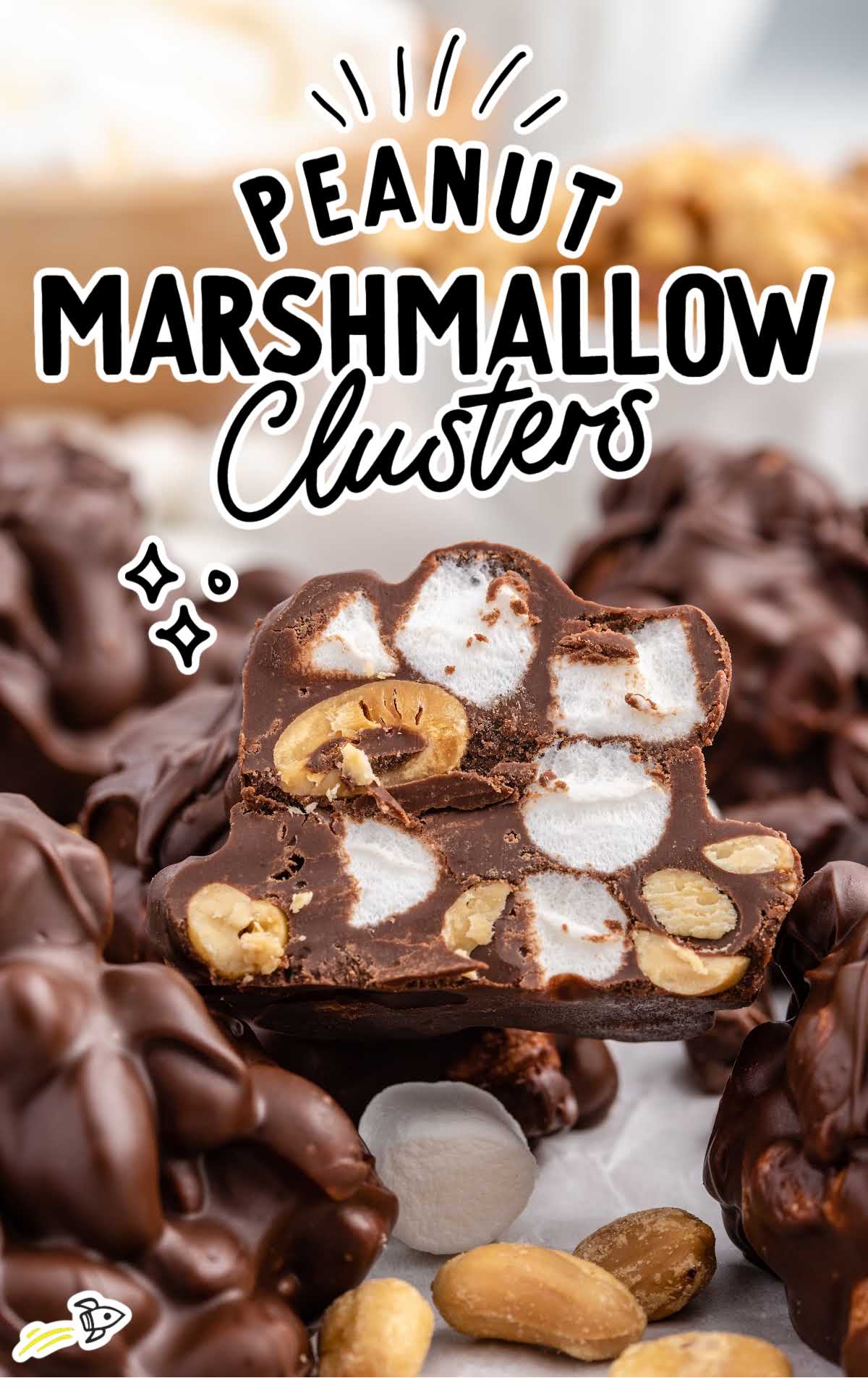 a close up shot of Peanut Marshmallow Cluster with a bite taken out of it