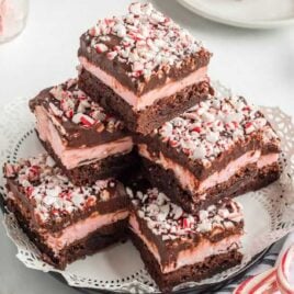 close up shot of Peppermint Brownies stacked on top of each other on a plate