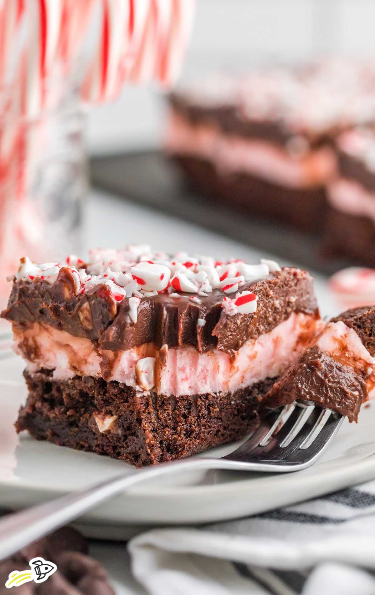 a close up shot of a slice of Peppermint Brownie on a plate