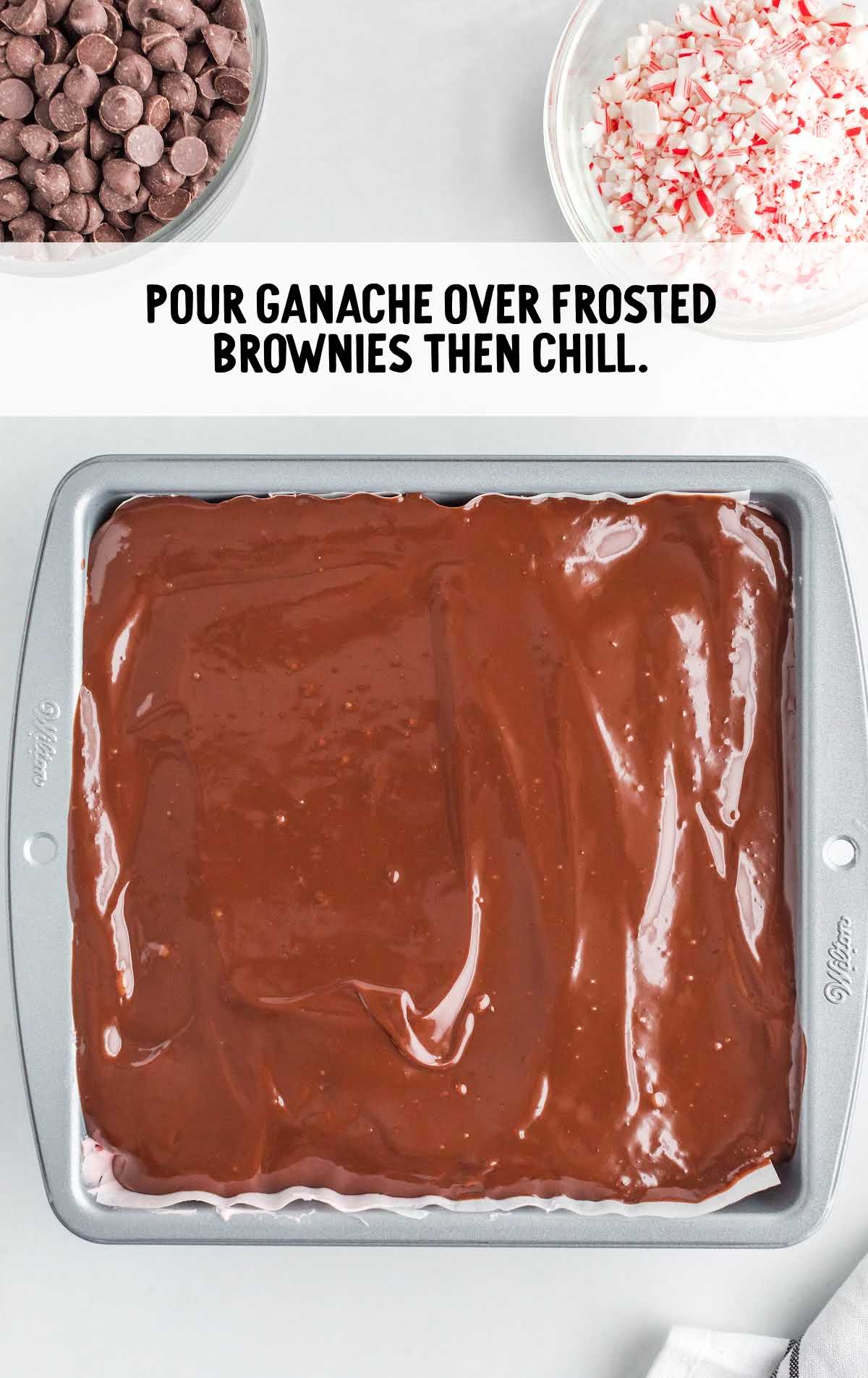ganche poured over the frosted brownies in a baking dish