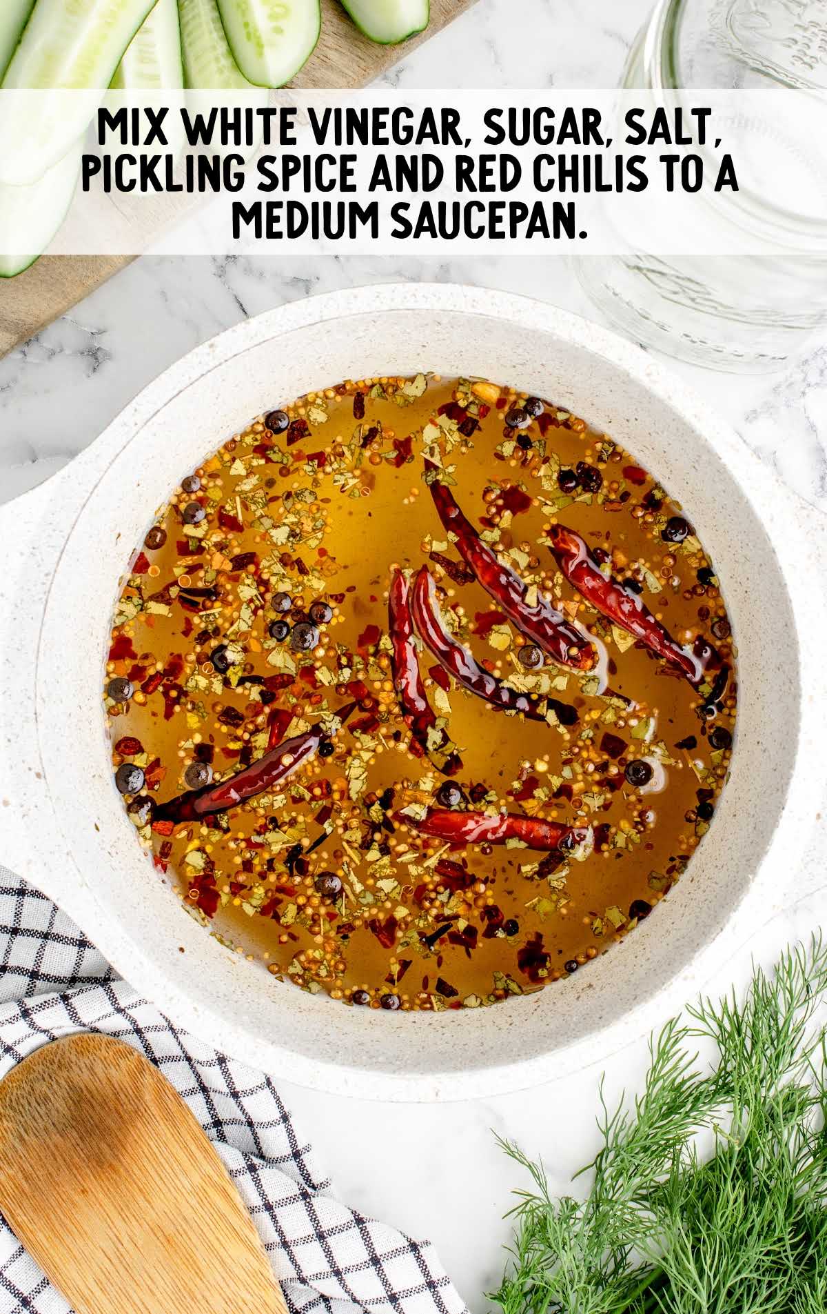 vinegar, sugar, salt, pickling spice and red chilies mixed in a bowl