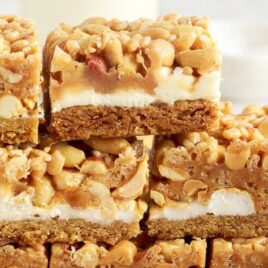 a close up shot of Salted Nut Roll Bars stacked on top of each other