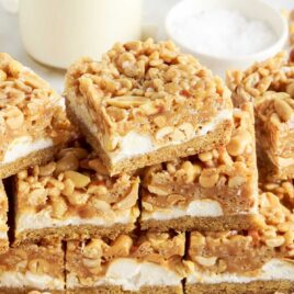 a close up shot of Salted Nut Roll Bars stacked on top of each other
