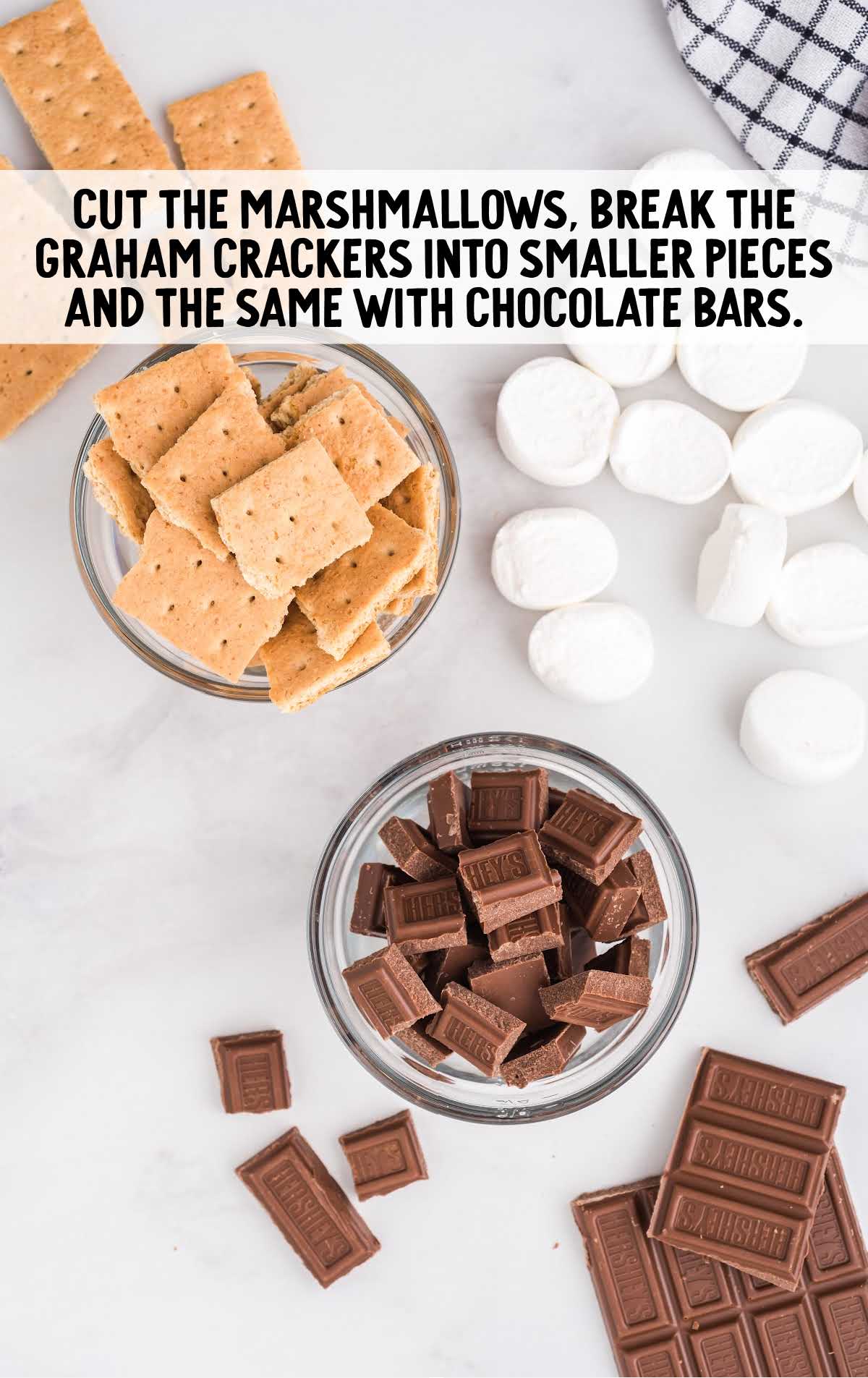marshmallows, graham crackers and chocolate bars broken into smaller pieces