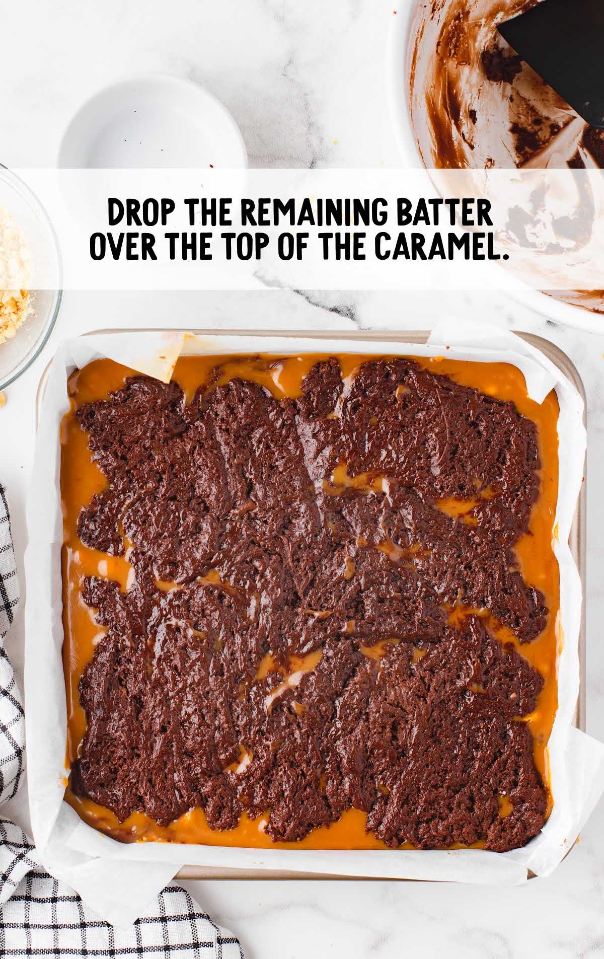 batter dropped over the top of the caramel in a baking dish