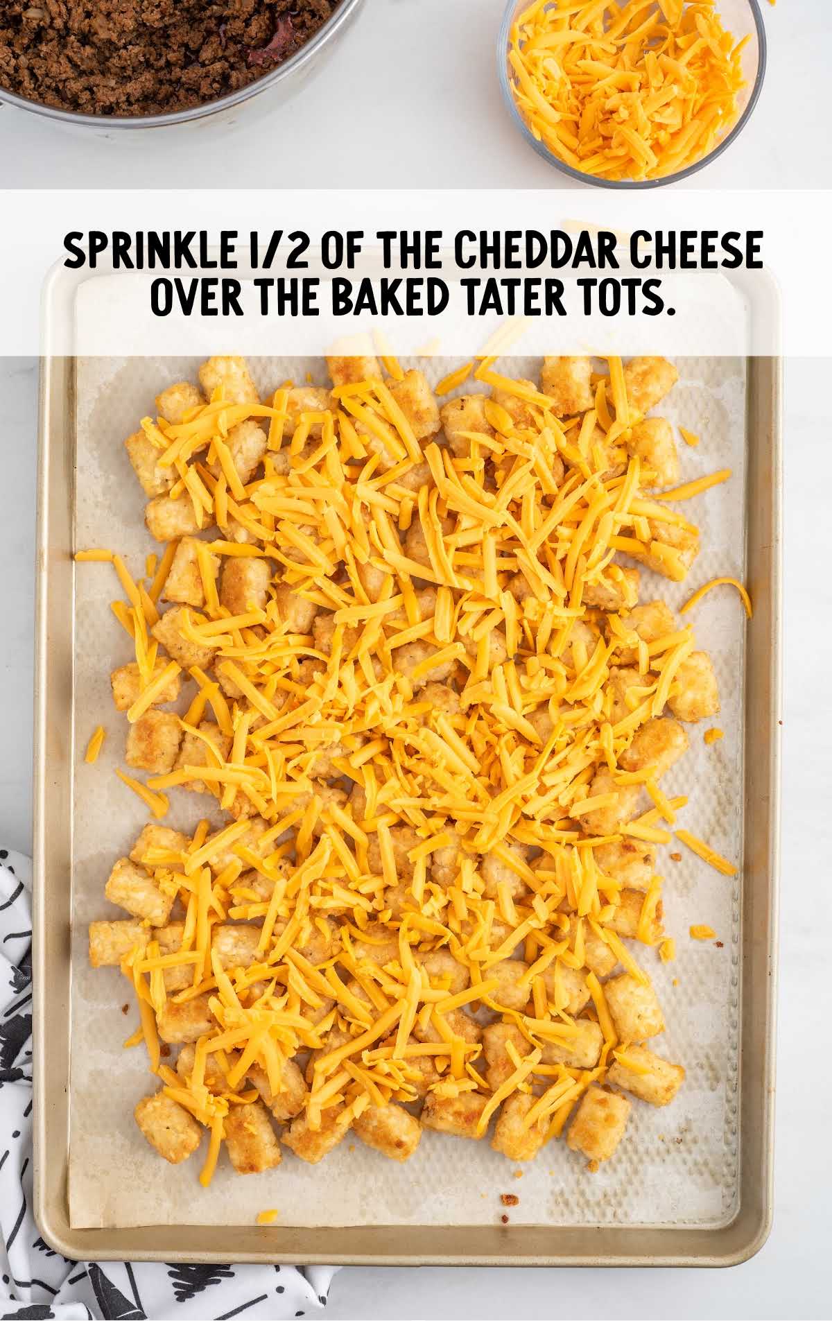 cheddar cheese sprinkled over the tater tots